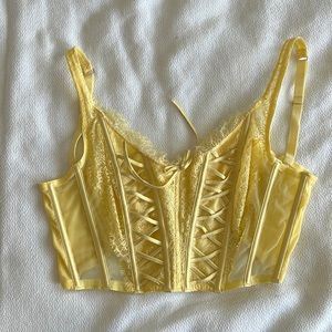 Victoria’s Secret Lace Up sheer pale yellow crop corset bra.